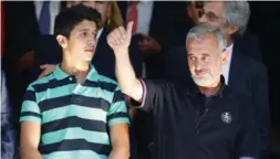  ?? FRANCISCO SECO/THE ASSOCIATED PRESS FILE PHOTO ?? Osama Abdul Mohsen, right, stands with his son Mohammad at a Spanish La Liga soccer match in September 2015.