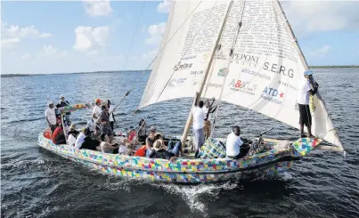  ?? PHOTO: REUTERS ?? Sustainabl­e sailing . . . People take part in the maiden voyage of Flipflopi, the first sailing dhow made entirely of recycled plastic, after the launch ceremony on the island of Lamu, Kenya, on Saturday.