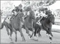  ?? The Sentinel-Record/File photo ?? GOING FOR ‘MORE: Jockey Ricardo Santana Jr., left, and Whitmore (4) pass Wilbo (5), with jockey David Cabrera, and Wynn Time (3), with Martin Pedroza aboard, to win the Grade 3 $400,000 Count Fleet Sprint Handicap on April 14 at Oaklawn Park.