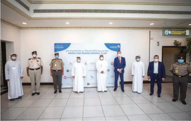  ??  ?? ↑
Top officials during the launch of a new initiative at Abu Dhabi Internatio­nal Airport on Saturday.