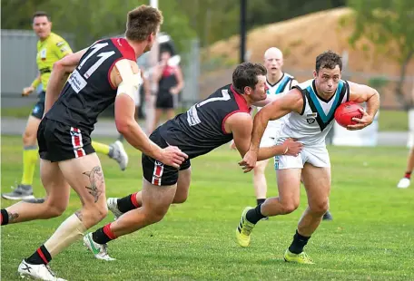  ?? ?? Warragul’s Mitch Nobelius tackles Wonthaggi’s Jarryd Blair in the senior match on Saturday.