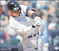  ?? The Associated Press ?? Adam Hunger
Aaron Judge hits an RBI single in his second first-inning at-bat Saturday afternoon as New York beat the Rays 10-3 at Yankee Stadium.