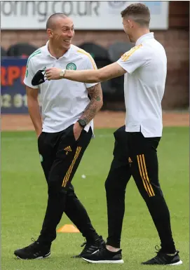  ??  ?? Celtic captain Scott Brown has words with team-mate Ryan Christie before the game at Tannadice on Saturday