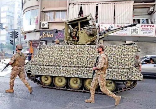  ?? Lebanese army soldiers deploy after deadly clashes erupted along a former 1975-90 civil war frontline in Ain el-remaneh neighbourh­ood, Beirut, Lebanon.
File/associated Press ??