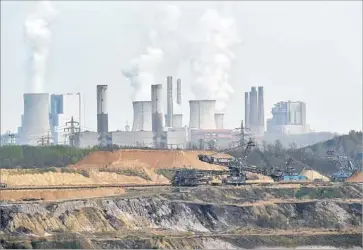  ?? Martin Meissner Associated Press ?? A U.S. official said at U.N. climate change talks in Bonn: “The administra­tion will not take actions that are contrary to the overarchin­g focus of competitiv­eness and economic growth.” Above, a power plant in Germany.