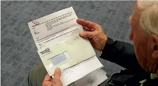  ??  ?? Takapuna Senior Citizen’s Associatio­n president Maurice Bowman, holds a copy of the email sent to the Citizens Advice Bureau regarding the associatio­n’s private business.