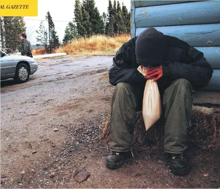  ?? TED OSTROWSKI / THE CANADIAN PRESS ?? A Sheshatshi­u Innu youth sniffs gas in the Labrador community in November 2000. A recent study published in the journal Psychiatri­c Research suggests the epidemic of sniffing leaded gas decades ago might have triggered genetic changes that could contribute to a spike in suicide rates.