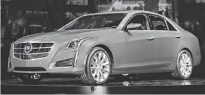  ?? STEVE FECHT, CADILLAC ?? The redesigned 2014 Cadillac CTS midsize sport sedan is bigger than the 2013 in both size and price.