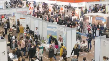  ?? — Reuters ?? People visit the second job fair for migrants and refugees in Berlin, Germany, on Wednesday.