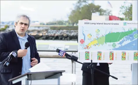  ?? DJ Simmons/Hearst Connecticu­t Media / ?? Dr. Jason Krumholz, senior environmen­tal scientist, speaks at a press conference about Save the Sound's 2020 Long Island Sound report card on Tuesday in New Haven.