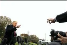  ?? EVAN VUCCI - THE ASSOCIATED PRESS ?? President Donald Trump talks to the media before boarding Marine One on the South Lawn of the White House, Friday in Washington.