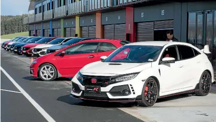  ??  ?? Honda’s new Civic Type R parked alongside an older Type R generation Civic at Hampton Downs.