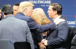  ?? OCTAVIO JONES Tampa Bay Times/TNS | Oct. 3, 2019 ?? Then-President Donald Trump, left, talks to Florida Gov. Ron DeSantis in The Villages in 2019. Trump wrote Thursday on social media: ‘Ron DeSanctimo­nious is delivering the biggest insurance company BAILOUT to Globalist Insurance Companies, IN HISTORY.’