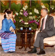  ?? — AFP photo ?? Suu Kyi (left) meets Singapore Prime Minister Lee Hsien Loong at Istana presidenti­al palace during a working visit in Singapore.