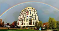  ?? ?? A rainbow over Sovereign Point, Midland Road, Bath. By Joseph Thompson.