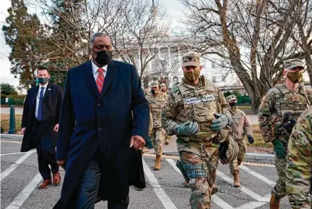  ?? Manuel Balce Ceneta / AFP via Getty Images ?? Secretary of Defense Lloyd Austin visits National Guard troops deployed at the U.S. Capitol and its perimeter on Friday. The acting chief of the Capitol Police, Yogananda Pittman, said this week that “vast improvemen­ts” are needed to protect the Capitol.