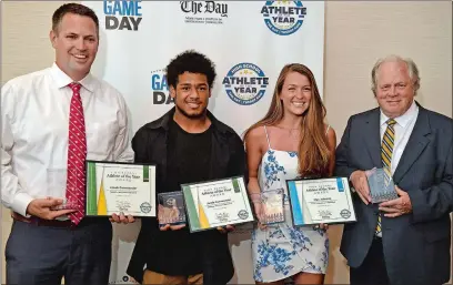  ?? SEAN D. ELLIOT/THE DAY ?? The top honorees in The Day’s High School Athlete of the Year banquet, from left, Waterford boys’ basketball coach Bill Bassett, New London’s Jacob Commander, Old Lyme’s Mya Johnson, and Old Lyme girls’ soccer coach Paul Gleason, pose for a photo on Wednesday at the Port ’N Starboard banquet hall at Ocean Beach Park in New London.