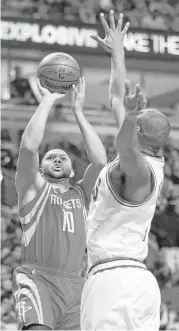  ?? Nam Y. Huh / Associated Press ?? Rockets guard Eric Gordon, left, takes a shot against Bulls forward Cristiano Felicio during Friday night’s game in Chicago.