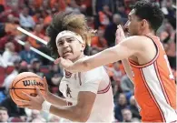  ?? (AP photo/Morry Gash) ?? Arkansas’s Anthony Black is fouled by Illinois’s RJ Melendez Thursday during the second half of a first-round college basketball game in the NCAA Tournament in Des Moines, Iowa.