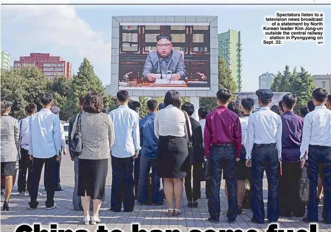  ?? AFP ?? Spectators listen to a television news broadcast of a statement by North Korean leader Kim Jong-un outside the central railway station in Pyongyang on Sept. 22.