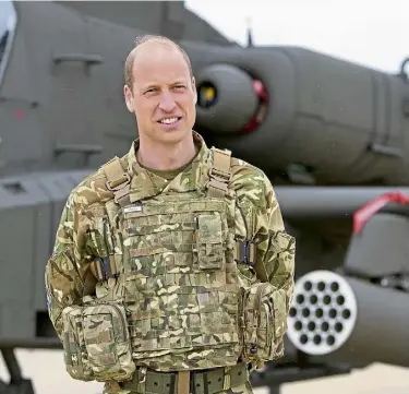  ?? ?? TITLE: The Prince of Wales in front of an Apache attack helicopter in his new role as Colonel-in-Chief of the Army Air Corps, and right, with the King.