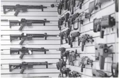  ?? ?? According to the Philippine National Police, private citizens can now have a license to own rifles with the classifica­tion of semi-automatic. Photo shows a display of various models of semi-automatic rifles.