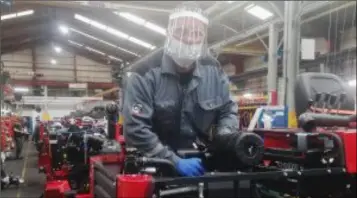  ??  ?? A worker at the Moffett plant wearing a face mask as part of the PPE equipment employees are now wearing as part of their return to work protocol.