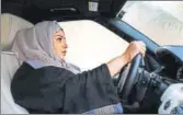  ??  ?? A woman driving in Jeddah on Wednesday. Saudi Arabia will allow women to drive from next June, state media said.