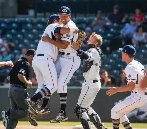  ?? NWA Democrat-Gazette/BEN GOFF ?? Greenwood players Brandon Woosley (from left), Connor Noland, Jake Smith and Chance Sneathern celebrate Saturday after the Bulldogs’ 4-0 victory over Benton in the Class 6A championsh­ip game.