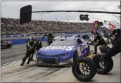  ?? JAE C. HONG — THE ASSOCIATED PRESS ?? Kyle Busch (8) makes a pit stop during a NASCAR Cup Series auto race at Auto Club Speedway in Fontana, Sunday.