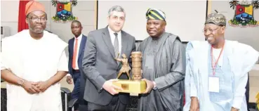  ?? Photo: Lagos Govt. House ?? Lagos State Governor, Mr. Akinwunmi Ambode (2nd right), presents a souvenir to Secretary- General, United Nations World Tourism Organisati­on (UNWTO), Mr. Zurab Pololikash­vili (2nd left), while the Minister of Informatio­n & Culture, Alhaji Lai Mohammed...