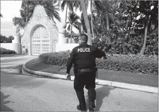  ?? Joe Cavaretta via TNS ?? A police officer patrols outside Mar-a-lago in Palm Beach ontuesday, the day after the FBI raided Donaldtrum­p’s estate.