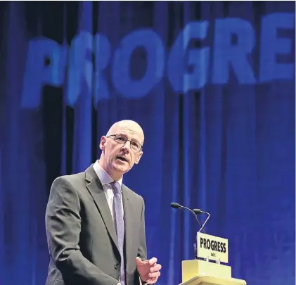  ?? Pictures: PA. ?? Above: Deputy First Minister John Swinney delivers the opening address to delegates at the Scottish National Party conference in Glasgow. Right: delegates listen to his speech. Below: party leader Nicola Sturgeon applauds Mr Swinney.