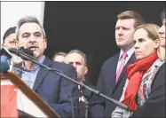  ?? Arnold Gold / Hearst Connecticu­t Media ?? Michael Song, left, speaks at a news conference about gun safety following the death of his son, Ethan, in front of First Congregati­onal Church across from the Guilford Green on Nov. 27. Ethan’s mother, Kristen, is at right.