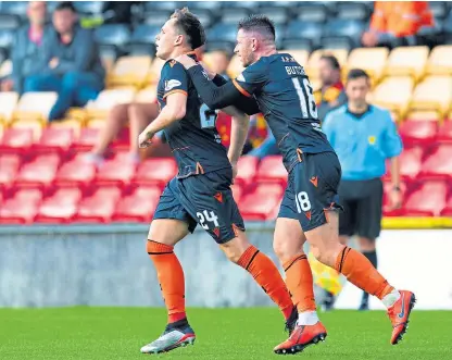  ?? Picture: SNS. ?? Lawrence Shankland celebrates with Calum Butcher after equalising for United.