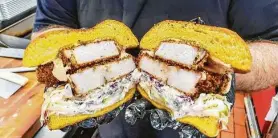  ??  ?? Roegels Barbecue serves a smoked turkey Katsu sandwich.