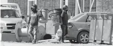  ?? PATRICK DOYLE • REUTERS ?? Constructi­on workers at a building site for new homes in Ottawa.