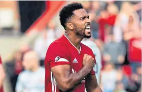  ?? Picture: SNS. ?? Aberdeen paid the penalty for a Shay Logan shirt pull.