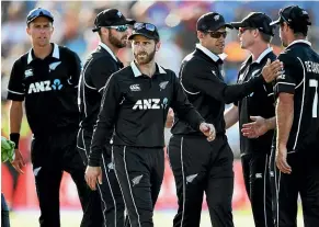  ?? PHOTOSPORT ?? Kane Williamson, centre, and the Black Caps have plenty to think about as India take a strangleho­ld on the five-match one-day series against New Zealand.