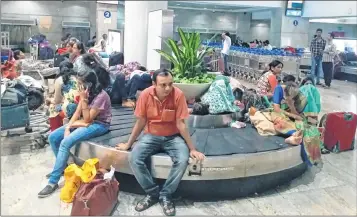  ??  ?? Passengers had to spend the day at the airport during the downpour on Tuesday.