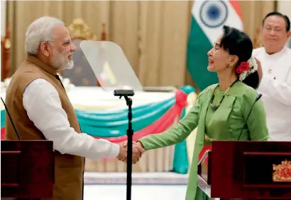  ?? Reuters ?? Narendra Modi and Aung San Suu Kyi shake hands after their joint press conference in Naypyitaw, Myanmar, on Wednesday. —