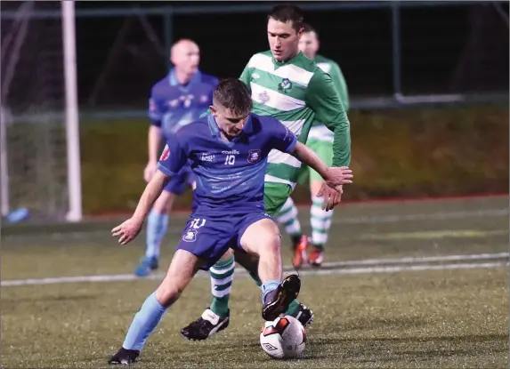  ?? Adam O’Rourke Dingle chased by Pa McGrath Killarney Celtic in control at Celtic Park, Killarney on Friday. Photo by Michelle Cooper Galvin ??