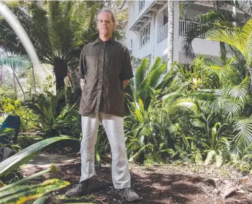  ?? ?? Campaigner Geoff Holland at the site of the felled tree at Palm Cove. Picture: Brian Cassey