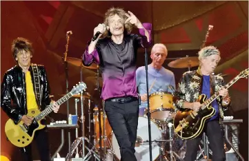  ??  ?? The Rolling Stones, Ronnie Wood, Mick Jagger, Charlie Watts and Keith Richards perform during The Rolling Stones North American “ZIP CODE”Tour - Nashville at LP Field on June 17, 2015 in Nashville,Tennessee. Jagger and Keith Richards are working on new...