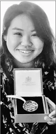  ?? — Bernama photo ?? Quah showing the prestigiou­s Queen’s Young Leaders medal that she received from Queen Elizabeth II.