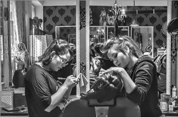  ??  ?? Beautician­s Sadaf (left), 17, and Rubina, 20, tend to a client. — AFP photos by Rebecca Conway