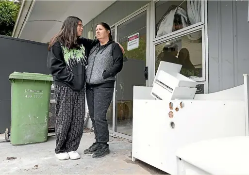  ?? ROSS GIBLIN/STUFF ?? Juanita MacDonald and her daughter Shinelia, 17, at their flooded-out home in Plimmerton. While they have emergency accommodat­ion their long-term housing future is uncertain.