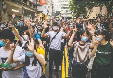  ?? DALE DE LA REY/AFP VIA GETTY IMAGES ?? Protesters rally against a new national security law in Hong Kong on July 1, the 23rd anniversar­y of the city’s handover from Britain to China. Within hours, the law was used to arrest Hongkonger­s still willing to brave the streets in protest.