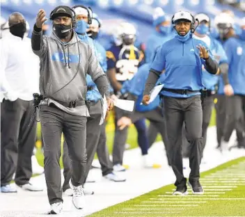  ?? ADRIAN KRAUS AP ?? Chargers coach Anthony Lynn (left) took responsibi­lity for miscommuni­cation issues at end of Sunday’s game.