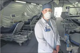  ?? SHERRY LAVARS — MARIN INDEPENDEN­T JOURNAL ?? Dr. Kristen Swann, an emergency room physician at Kaiser Permanente in San Rafael, in a coronaviru­s care tent outside the hospital.